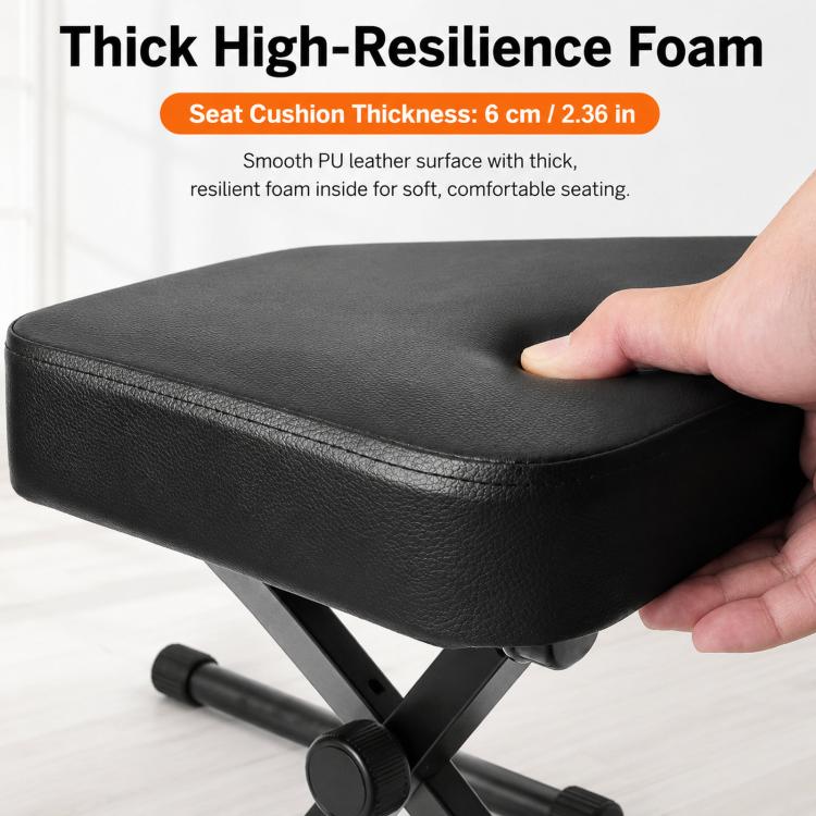 Thick black padded piano stool seat with textured surface and X-frame legs