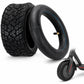 Black scooter tire with knobby tread and inner tube, blue rim stripe