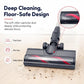 Motorized floor brush head with dark body and red-striped roller on hardwood floor