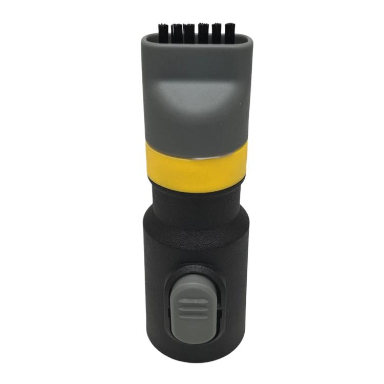Shoe washing brush attachment with black body, gray top, and yellow ring button area