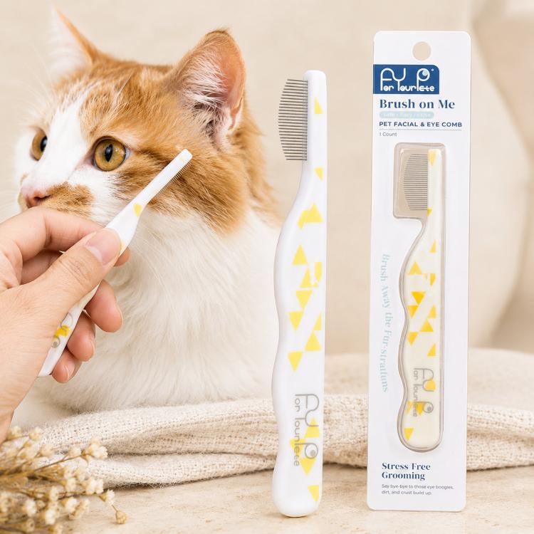 White pet facial and eye comb with fine metal teeth and curved safety pins