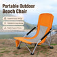 Orange portable folding beach chair with mesh back and side cup holder pouch