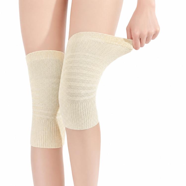 Cotton knee pads, beige short knit sleeves worn on knees, close side angle