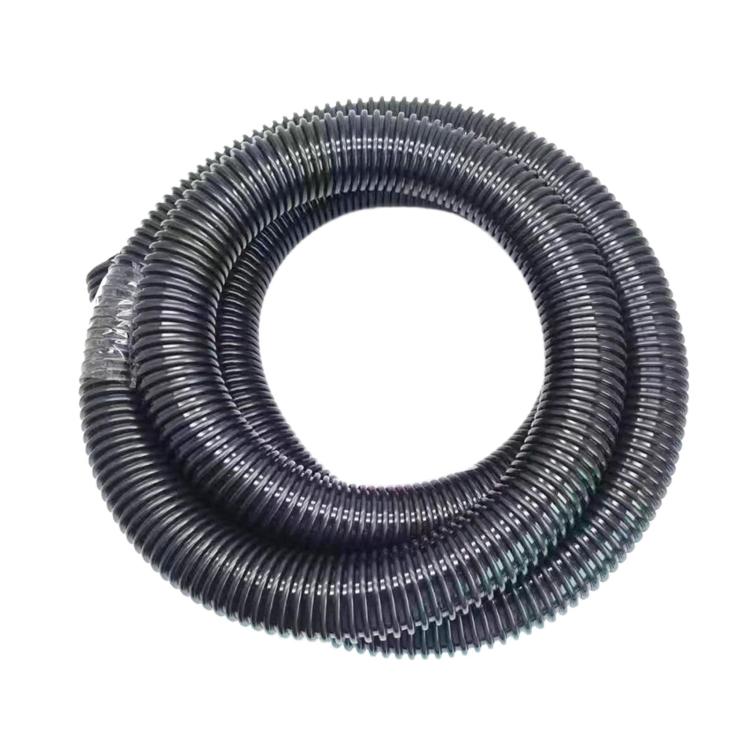 Coiled ribbed vacuum cleaner hose, dark flexible corrugated tubing