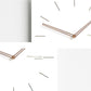 Square wall clock close-up of dark wood hands and round center knob on white face
