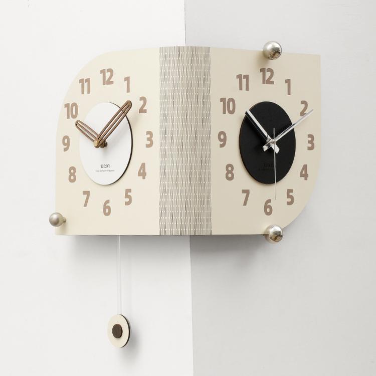 Beige dual-dial corner wall clock with gold hands and silver knob mounts