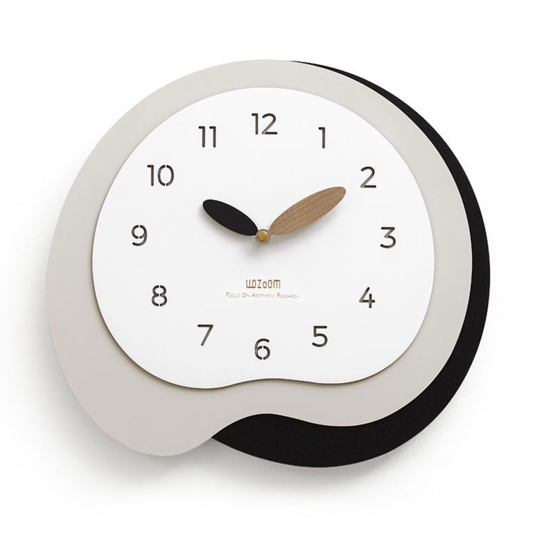 Irregular wall clock with white face, dark gray outer ring, gold and black hands