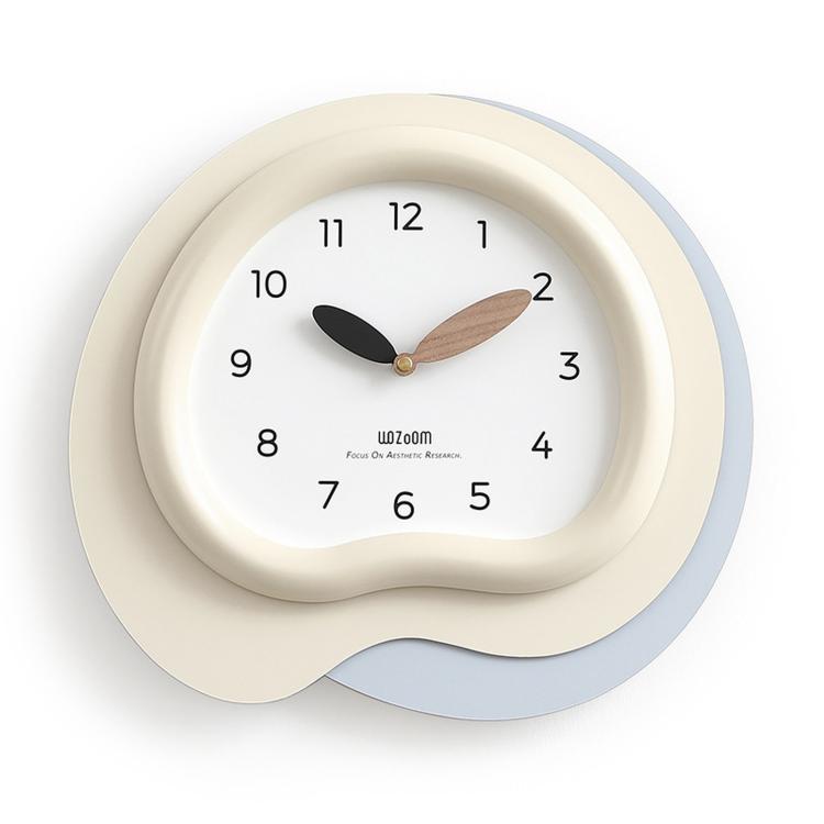 Irregular wall clock with cream frame and light blue outer ring, black and wood hands