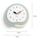 Irregular wall clock with mint green frame, white dial, wood hands (38×35cm)