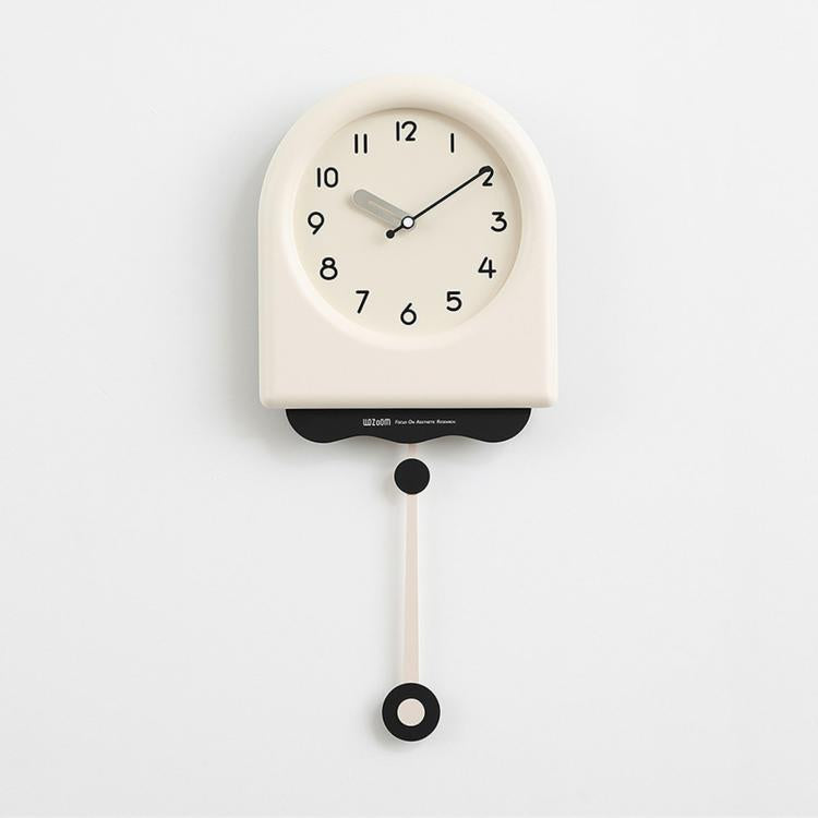 Cream pendulum wall clock with off-white dial, black hands, and hanging pendulum weight.