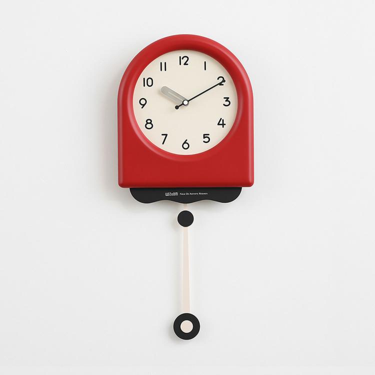 Red pendulum wall clock with cream dial and hanging pendulum weight.