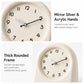 Cream round wall clock with black numerals and silver-toned clock hands