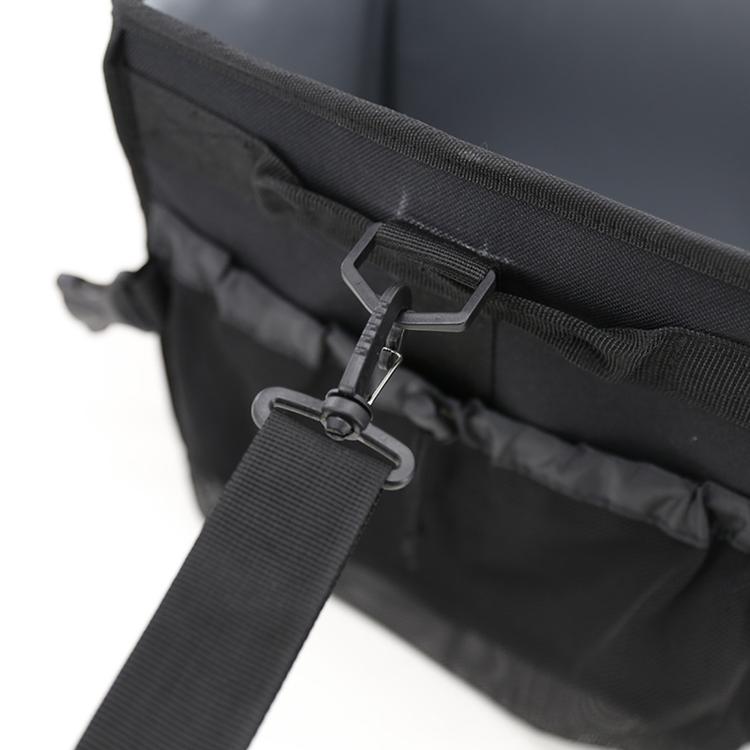 Close-up of outdoor storage bag buckle strap and reinforced zipper flap