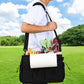 Person carrying outdoor grill storage bag with shoulder strap, front zip pocket