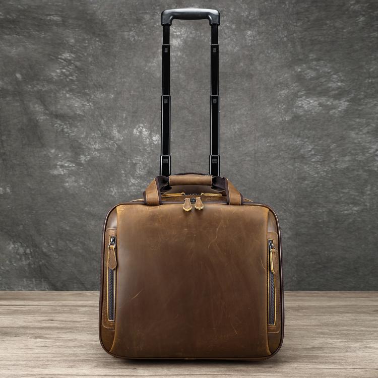 Light brown leather rolling briefcase with upright pull handle and side zip pockets