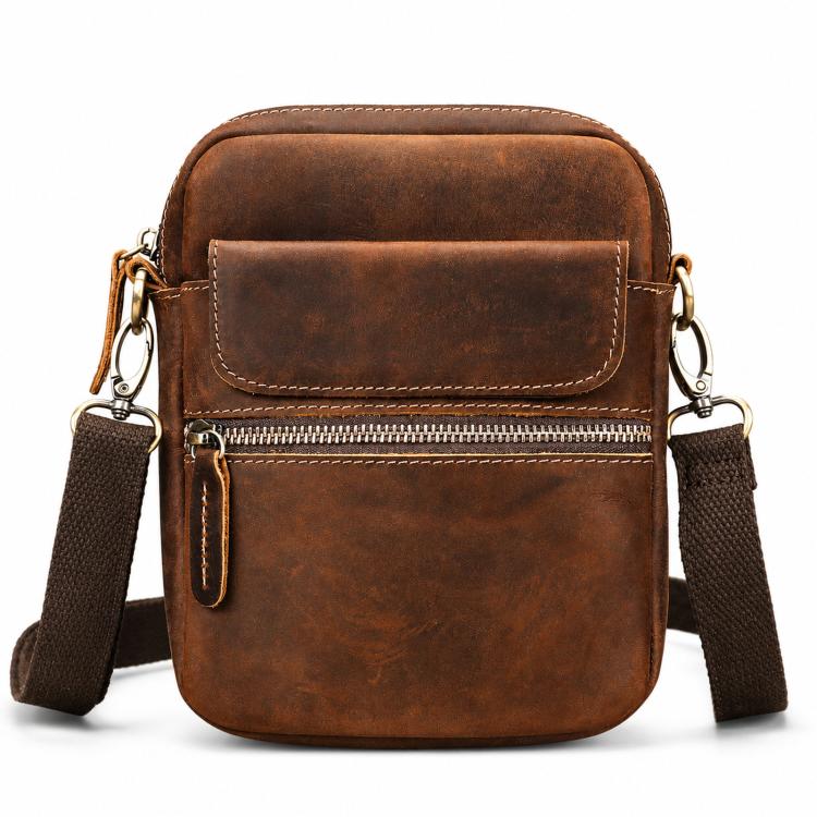 Brown vintage leather crossbody bag with front flap and zip pocket, adjustable strap