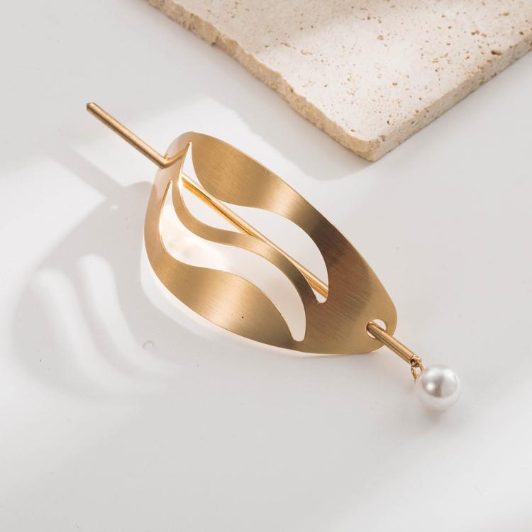Gold geometric hair bun cuff slide with wavy cutout and pearl end pin