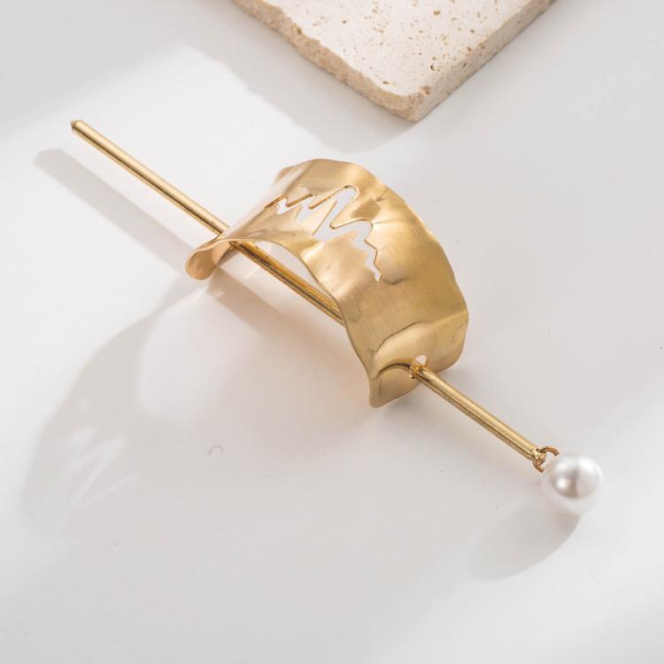 Gold hair bun cuff slide with raised zigzag texture and pearl drop pin