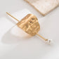 Gold hair bun cuff slide with hammered texture and pearl end pin