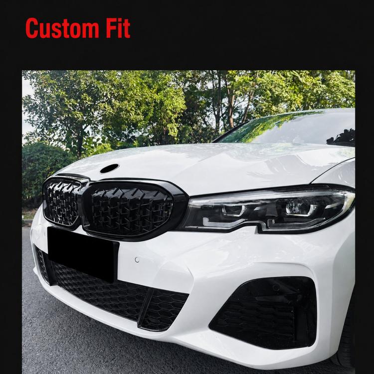 Front kidney grille installed on a white car, black mesh with a glossy frame