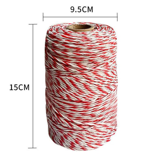 Red and white braided electric fence conductive rope, coiled on a spool