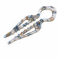 Light blue and brown marbled acetate U-shaped hair pin with 2 prongs, fish bun holder.