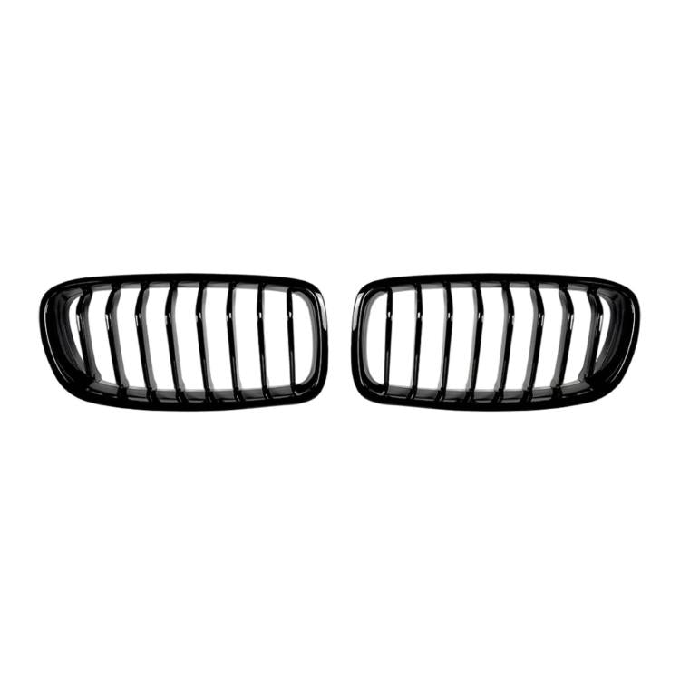 Front kidney grille pair with chrome vertical slats and black plastic surround.