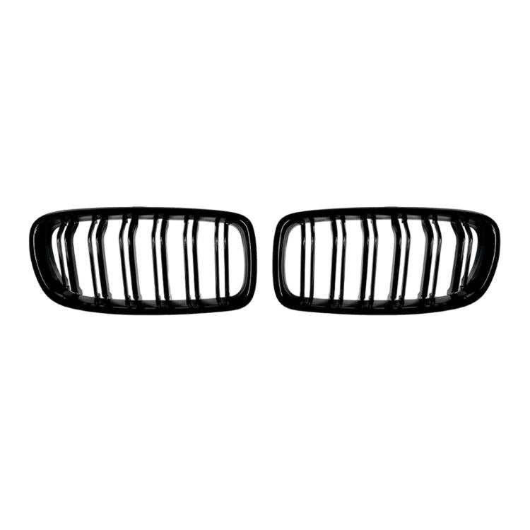Front kidney grille pair with chrome vertical slats and black surround, centered.