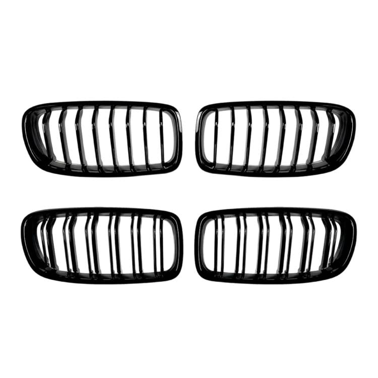 Front grille set with two kidney openings, chrome vertical slats, black frame.