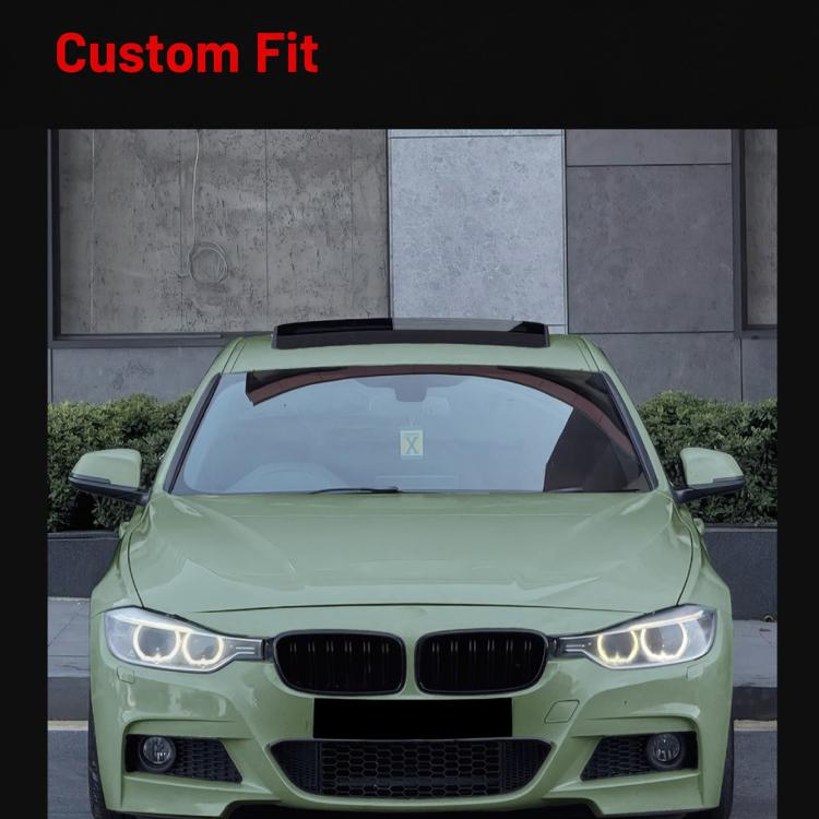 Vehicle front grille: black twin kidney grilles with chrome vertical slats.