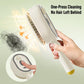 Electric spray hair massage brush with white handle and round detangling comb head