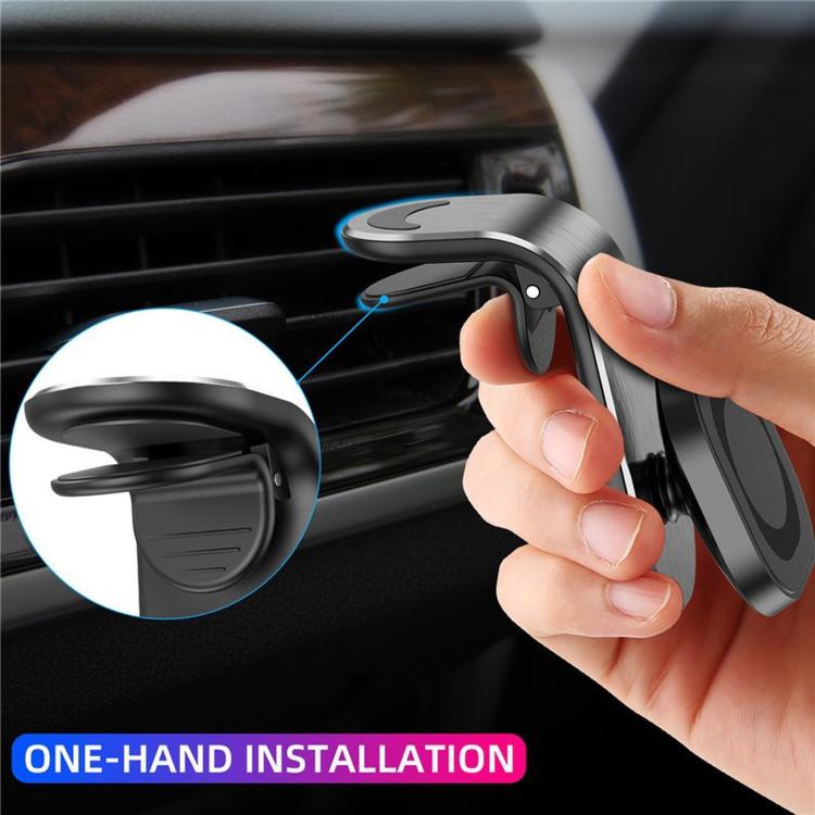 Hand installing L-shape car phone holder on an air vent