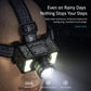 Black LED headlamp worn on head, front beam shining with side LEDs on