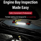 Portable LED inspection light illuminating an engine bay