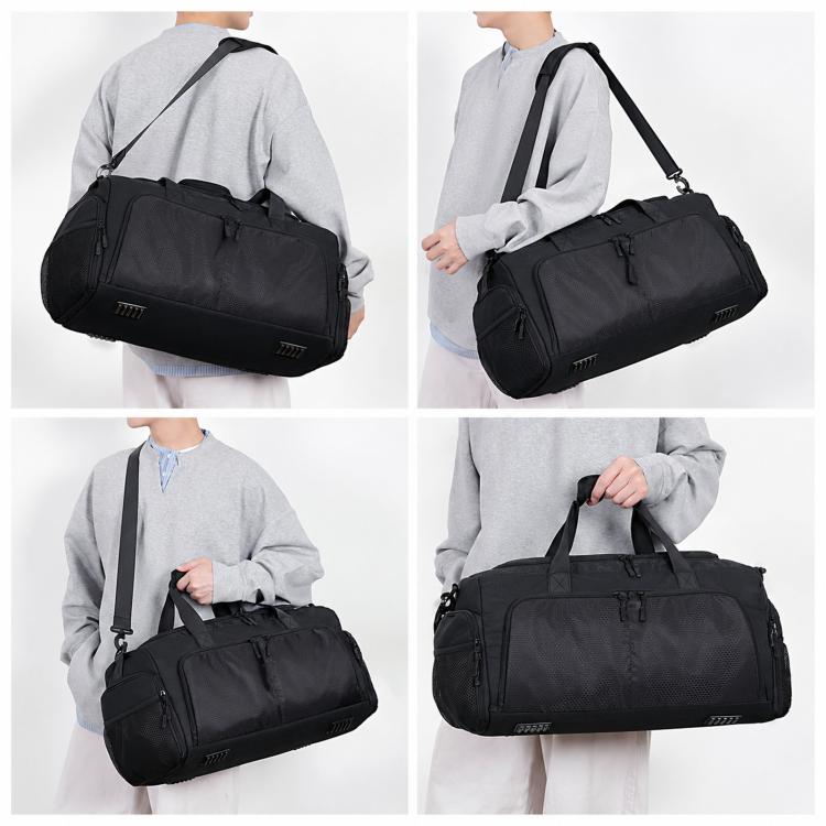 Black sports duffel bag with padded shoulder strap and zippered front pockets