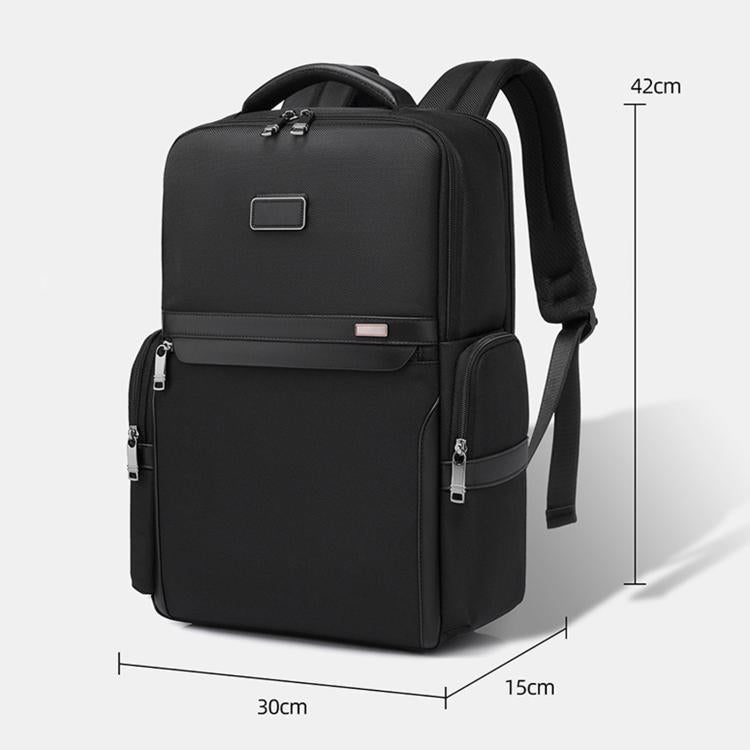 Black laptop backpack with top handle, front zip pocket, and padded shoulder straps