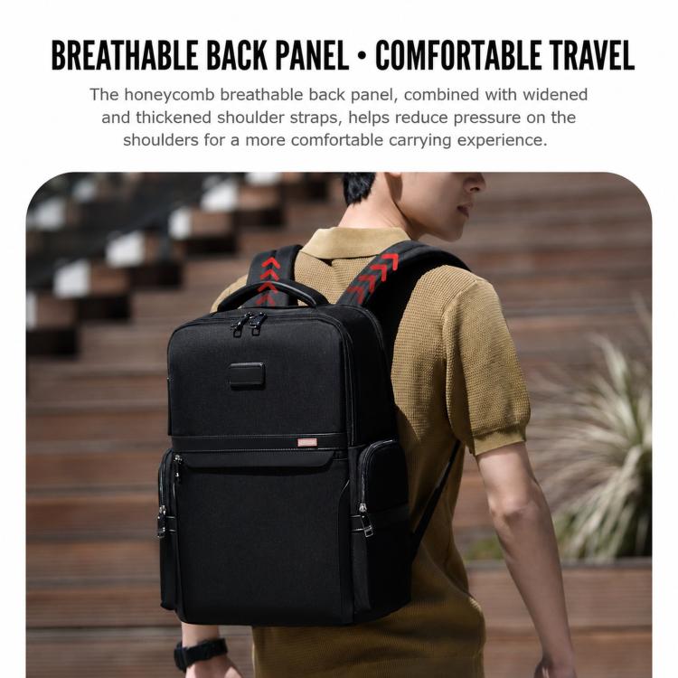 Black laptop backpack worn with padded shoulder straps and front zip pocket