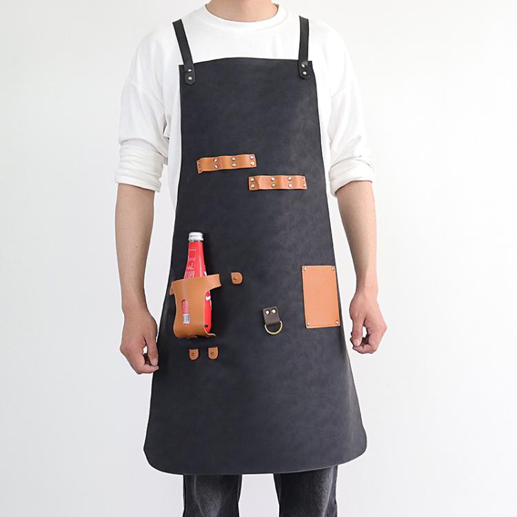 Black waterproof BBQ apron with tan leather straps and bottle holster pockets