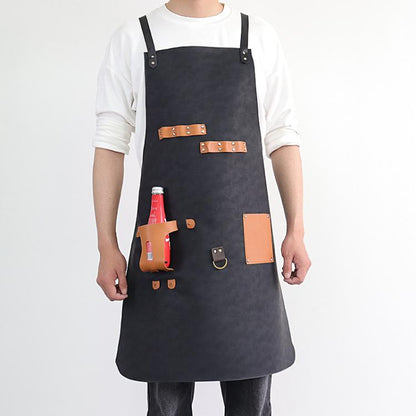 Black waterproof BBQ apron with tan leather straps and bottle holster pockets