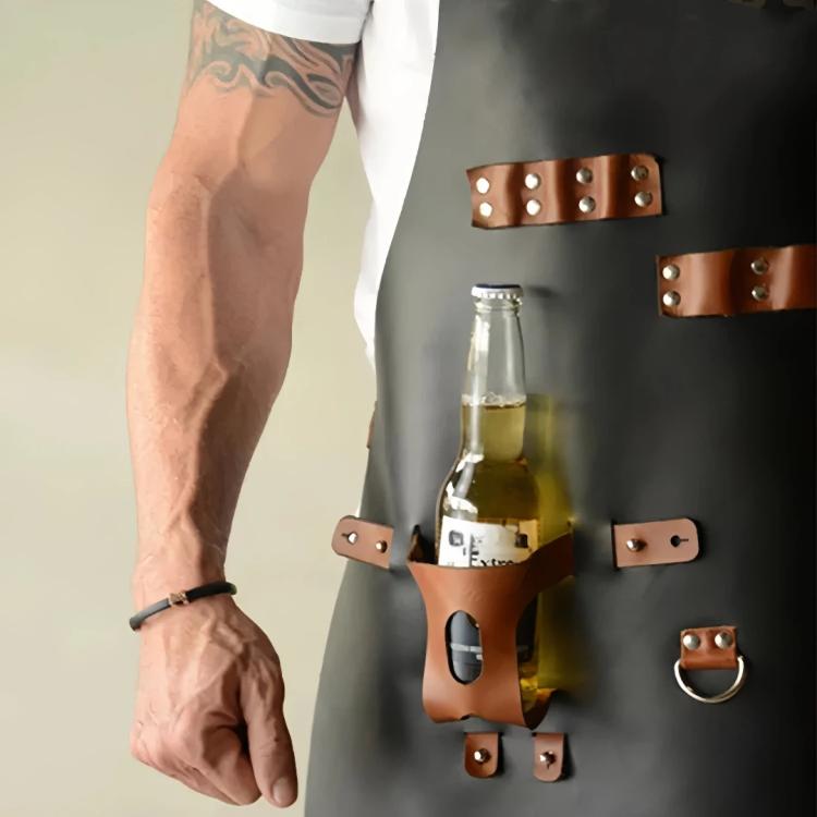 Black waterproof BBQ apron detail with bottle holster, rings, and leather pocket panels