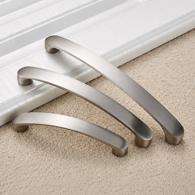 Brushed metal cabinet drawer pulls shown as multiple curved handles with end caps