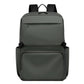 Green laptop backpack with zip front, top handle, and padded shoulder straps