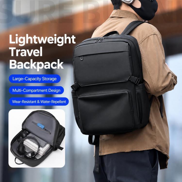 Black laptop backpack worn on the back, with front zip pocket and top handle