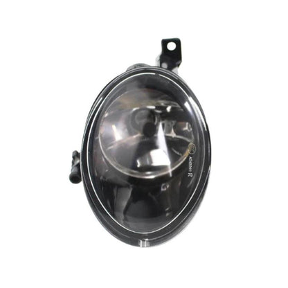 Front bumper fog light with clear lens and black housing, close-up view