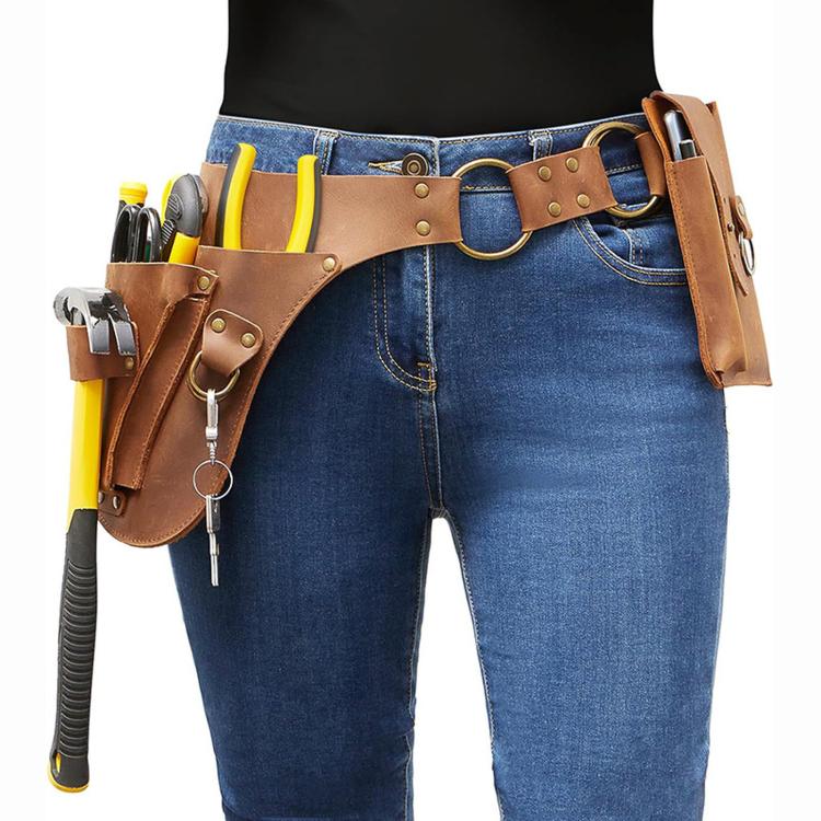 Brown leather tool belt worn on jeans with side tool loops and central waist pouch