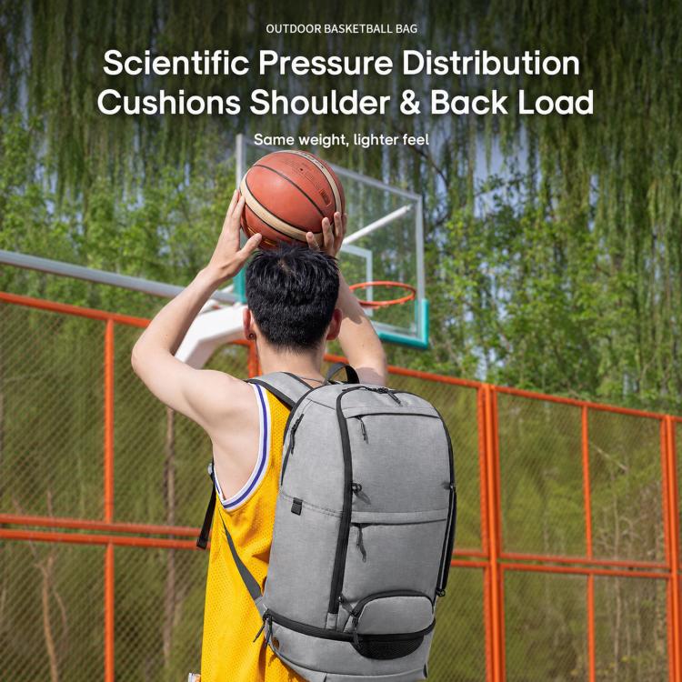Gray basketball backpack with padded straps and front zipper pocket, worn on back