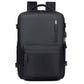 Black water-resistant travel laptop backpack with front zip pocket and top carry handle