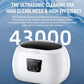 White ultrasonic cleaner with black control panel and dark top lid