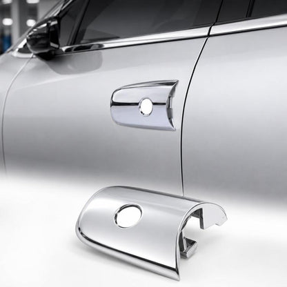Chrome front door handle cap cover for left driver side exterior, close-up on car door