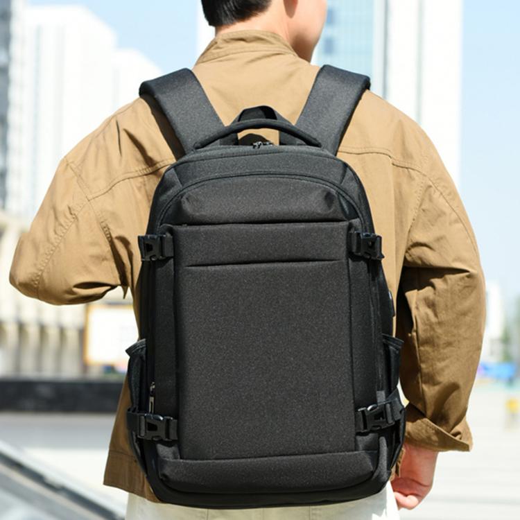 Black laptop backpack worn on back with padded straps and front organizer pocket